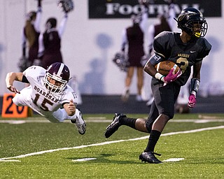 MICHAEL G TAYLOR | THE VINDICATOR- 10-06-17  FOOTBALL Boardman Spartans vs Warren Harding, Harding High School, Mollenkopf Stadium, Warren, OH..1st qtr., Harding's Jeremy Wilson #3 runs for a 56 yards TD punt return as Boardman's Jacob Mahood #15 makes diving tackle attempt