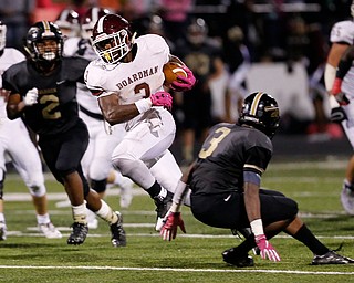 MICHAEL G TAYLOR | THE VINDICATOR- 10-06-17  FOOTBALL Boardman Spartans vs Warren Harding, Harding High School, Mollenkopf Stadium, Warren, OH..2nd qtr., during a 20 yard plus run, Boardman's Domonhic Jennings #3 puts a move on Harding's Jeremy Wilson #3