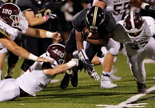 MICHAEL G TAYLOR | THE VINDICATOR- 10-06-17  FOOTBALL Boardman Spartans vs Warren Harding, Harding High School, Mollenkopf Stadium, Warren, OH..2nd qtr., Harding's Jujuan Forte #5 is slowed by Boardman's Steven Amstutz #50 and Connor Miller #33 and finished off by Boardman's #23 Kareem Hamdan