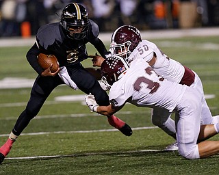 MICHAEL G TAYLOR | THE VINDICATOR- 10-06-17  FOOTBALL Boardman Spartans vs Warren Harding, Harding High School, Mollenkopf Stadium, Warren, OH..2nd qtr., Harding's Chris Chew #6 is tackle for a loss by Boardman's Steven Amstutz #50 and Connor Miller #33.