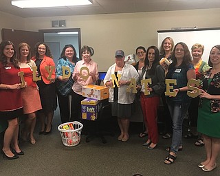 Above, Junior League of Youngstown members donating diapers for “Diaper Need Awareness Week,” in front, from left, are Paige Rassega, Michele Merkel, Jessica Foster, Elizabeth Kijowski, Mercia Stephens, Heather Elder, Carisa Sechrist, Carrie Zapka and Kelly Frammartino. In back, from left, are Kristina Ross-Pavlicko, Beth Drennen and Kathryn Scheel. 