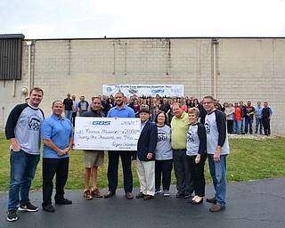 GBS employees recently presented a gift of $21,000 to Rescue Mission of the Mahoning Valley President and CEO, John Muckridge. The funds were raised as part of GBS’s “Year of Giving Initiative.” The GBS YOGI committee hosted its first charity golf tournament Aug. 7 at Tippecanoe Country Club in Canfield. The GBS charitable donations committee is comprised of GBS employees with significant charitable activity experience, and those who have a passion for finding ways to give back. The mission at GBS is to provide a venue in which its employees can freely make a gift of time, talent and treasure to those within the community who are in need. Above, from left, are Zach Schlimm; Eugene Calabria, CEO/president of GBS; Joe Chahine; Muckridge; Co-sponsor Shorty Navarro, owner of Stadium GM dealership in Salem; Karen Calabria; Mike Hudock, general manager of Stadium GM; Michele Benson; and Mark Kiraly.