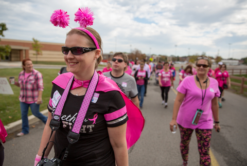 Stephanie Rhodes of Cortland, walks with pink pride in support for breast cancer awareness at Austintown High School on Saturday morning.