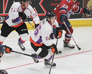 William D Lewis the Vindicator  PhantomsMatthew Barry(26) moves the puck past Chicago's Marko Reifenberger(22). Behind them isPhantoms Liam Dennison(72)