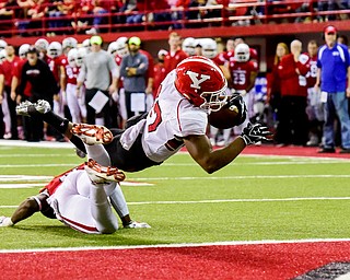 Youngstown State tailback Tevin McMaster (37) dives into the end zone for a touchdown against University of South Dakota during the first half at the DakotaDome on Saturday, Oct. 7, 2017 in Vermillion, S.D.