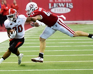 Youngstown State running back Christian Turner (20) pushes past University of South Dakota defensive lineman Darin Greenfield (44) during the second half at the DakotaDome on Saturday, Oct. 7, 2017 in Vermillion, S.D.