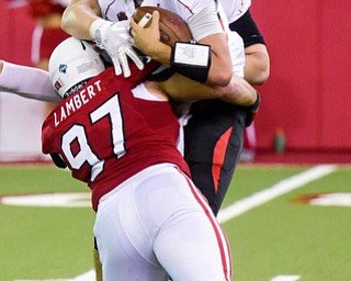 Youngstown State quarterback Nathan Mays (7) gets sacked by University of South Dakota defensive tackle Taylor Lambert (97) on the last play of the game during the second half at the DakotaDome on Saturday, Oct. 7, 2017 in Vermillion, S.D.