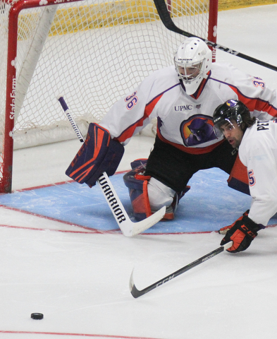 William D. Lewis The Vindicator  Phantoms goalie Wouter Peeters(36) and Andrew Petrillo(5) block a shot during 10-8-17 action a Covelli.