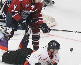 William D. Lewis The Vindicator Phantoms Chase Gresock(19) and Chicaog's Sebastian Dirven(4) battle for the puck during 10-8-17 action at Covelli.