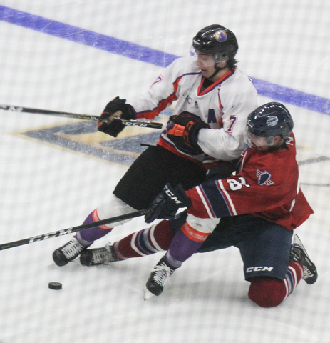 William D. Lewis The Vindicator  Phantoms Eric Esposito(7) and Chicago's SeMatthew Barry(26) battle for the puck during 10-8-17 action at Covelli.