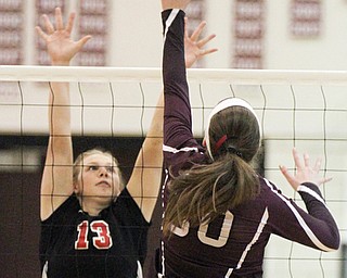 William D. Lewis The Vindicator Canfield's Morgan Cleevely(13) blocks a shot from Boardman's Ashley Clark(30) during 10-9-17 action at Boardman.