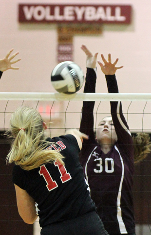 William D. Lewis The Vindicator  Canfield's Alyssa Householder(11) shoots past Boardman's Ashley Clark(30) during 10-9-17 action at Boardman.