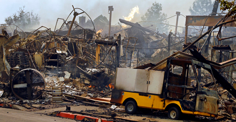 The Hilton hotel is destroyed Monday, Oct. 9, 2017, in Santa Rosa, Calif. Wildfires whipped by powerful winds swept through Northern California early Monday, sending residents on a headlong flight to safety through smoke and flames as homes burned. (AP Photo/Ben Margot)