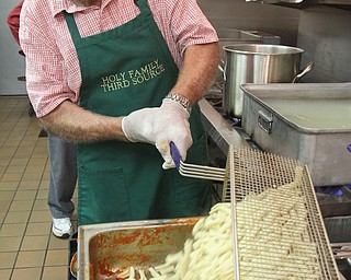 Chuck Maholtz prepares cavatelli at Holy Family Church in Poland for a recent pasta dinner.