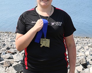 Archery enthusiast Selina Jones, a seventh-grade student at Brookfield Middle School, competed in the FITA Ohio State Outdoor Championships last month. She led the competition for the Ohio State champion in her age class and had the highest score of all the competitors, with a 1401 out of 1440. In addition to her most recent gold medal, Jones also received a gold medal at the Double 900 competition in May. She attended the North Region championships in August, where she received a silver medal for individual competition, a silver medal for a team competition and a gold medal for being on the top-scoring regional team. The regional team is comprised of the top four shooters, which means Selina is one of the top four shooters in the state. Above, Jones wears her FITA Ohio State Outdoor Championships Medal.