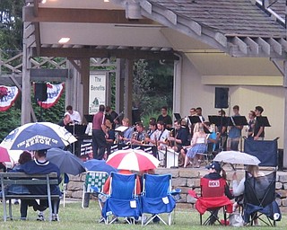 Neighbors | Zack Shively.Boardman High School Summer Jazz Ensemble performed at the Maag Outdoor Arts Theatre in Boardman park during the rain on Aug. 24.