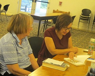 Neighbors | Zack Shively.Two members of Austintown library's Chapter Chat Book Club discussed Gene Luen Yang's "American Born Chinese" at their meeting on Aug. 30.