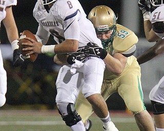 William D. Lewis the Vindicator Board,am QB Mike O'Horo?(8) is tackled bu Ursuline's Jason Bell(59) during 1rst half action 10-12-17 at Stambaugh.
