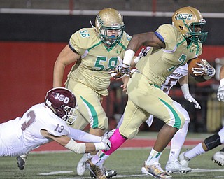 William D. Lewis the Vindicator Boardam's Mike Fetsko(13) tries to stop  Ursuline's Joe Floyd(7) during 1rst half action 10-12-17 at Stambaugh. Blocking is Ursuline'sLouie DelColle(58).
