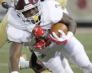 William D. Lewis the Vindicator Boardman's Domonhic Jennings(3) is tackled by Ursuline's Davion Jones(17) during 1rst half action 10-12-17 at Stambaugh.
