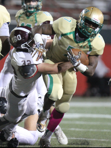 William D. Lewis the Vindicator BUrsuline'sJoe Floyd(7) is stopped by Boardman'sNeil Bevacqua?(32) during 1rst half action 10-12-17 at Stambaugh.