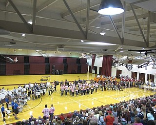 Neighbors | Zack Shively.The drumlines all played a final performance together after each school had played individually. Pictured are, from left, (front) Western Reserve, Liberty, Austintown, Boardman, Champion; (back) Howland, Youngstown State University and McDonald. They all played a commonly used drumline cadence.