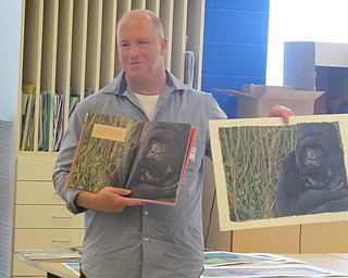Neighbors | Zack Shively.Chris Leeper showed an art class one of his paintings used in a children's book sponsored by the Smithsonian.
