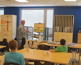 Neighbors | Zack Shively.Jennifer Houston's fifth-grade class at Austintown Intermediate School directed guest painter Chris Leeper on what to paint. Leeper started and finished a watercolor painting during the class.