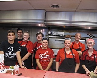 Neighbors | Zack Shively.Cocca's Pizza staff supplied the students with pizza, wings and drinks during the event. Cocca's Pizza has worked with Union Elementary to have this event yearly over the last six years. The staff present on Oct. 6 was, from left, (front) Kareem Hunt, Lindsay Loboy, Angel Collins, Heather Campbell; (back) Dylan Langer, Christina Vaclav, Katie Gennaro and James Nitzsche.