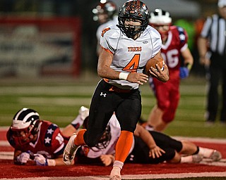NILES, OHIO - OCTOBER 12, 2017: Howland's Jackson Deemer runs the ball in the open field during the first half of their game Thursday night at Niles McKinley High School. DAVID DERMER | THE VINDICATOR