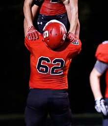 MICHAEL G TAYLOR | THE VINDICATOR- 10-13-17 FOOTBALL Hubbard Eagles vs Struthers Wildcats at Struthers High School, Struthers, OH..1st qtr., after a 53 yard td run, Struther's RB Nick Adams #2 celebrates with his teammate OL Jimmy Stefanski #62