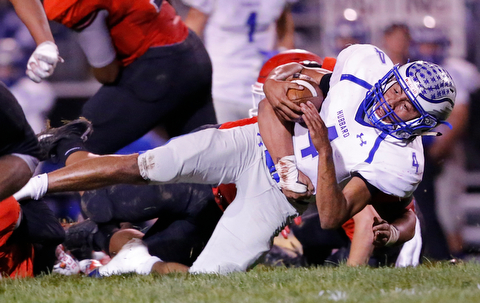 MICHAEL G TAYLOR | THE VINDICATOR- 10-13-17 FOOTBALL Hubbard Eagles vs Struthers Wildcats at Struthers High School, Struthers, OH..1st qtr., Hubbard's QB Davion Daniels #4  dives for the 1st down.