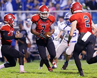 MICHAEL G TAYLOR | THE VINDICATOR- 10-13-17 FOOTBALL Hubbard Eagles vs Struthers Wildcats at Struthers High School, Struthers, OH..2nd qtr., after taking the handoff from Struthers' QB J.D. Hall #12 ,  Struther's RB Wille Mitchell #7 prepares to hand the ball to his teammate Nick Adams #2 on the reverse