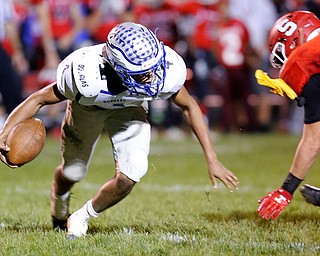 MICHAEL G TAYLOR | THE VINDICATOR- 10-13-17 FOOTBALL Hubbard Eagles vs Struthers Wildcats at Struthers High School, Struthers, OH..2nd qtr., Hubbard's QB Davion Daniels #4 escapes the would be tackle of Struthers' Connor Calabrette DL #48 as a penalty flag flies..
