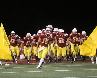 The Cardinals charge the field led by Antonio Page(15) during the first quarter as Warren Harding High School takes on Cardinal Mooney High School, Friday, Oct. 13, 2017, at Stambaugh Stadium in Youngstown...(Nikos Frazier | The Vindicator)..