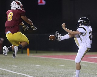 Warren Harding punter Cavinn Stouffer (20)'s punt is blocked by Cardinal Mooney defensive lineman Brennan Olesh (8) during the first quarter as Warren Harding High School takes on Cardinal Mooney High School, Friday, Oct. 13, 2017, at Stambaugh Stadium in Youngstown...(Nikos Frazier | The Vindicator)..