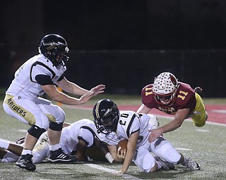 Warren Harding punter Cavinn Stouffer (20) dives for his blocked punt after it is blocked by Cardinal Mooney defensive lineman Brennan Olesh (8) during the first quarter as Warren Harding High School takes on Cardinal Mooney High School, Friday, Oct. 13, 2017, at Stambaugh Stadium in Youngstown. Cardinal Mooney defensive back Brent Weaver (11) dives to secure the ball...(Nikos Frazier | The Vindicator)..