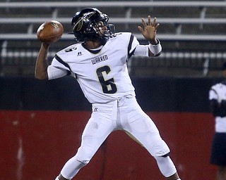 bWarren Harding quarterback Chris Chew (6) throws during the second quarter as Warren Harding High School takes on Cardinal Mooney High School, Friday, Oct. 13, 2017, at Stambaugh Stadium in Youngstown...(Nikos Frazier | The Vindicator)..
