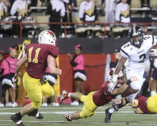Warren Harding running back Kayron Adams (2) is taken down by Cardinal Mooney defensive back Nico Marchionda (5) during the second quarter as Warren Harding High School takes on Cardinal Mooney High School, Friday, Oct. 13, 2017, at Stambaugh Stadium in Youngstown...(Nikos Frazier | The Vindicator)..
