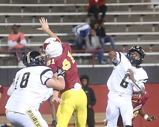Warren Harding quarterback Chris Chew (6) throws during the second quarter as Warren Harding High School takes on Cardinal Mooney High School, Friday, Oct. 13, 2017, at Stambaugh Stadium in Youngstown...(Nikos Frazier | The Vindicator)..
