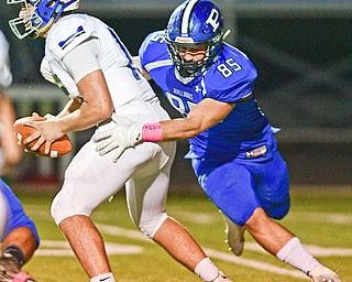 POLAND, OHIO - OCTOBER 13, 2017: Lakeview quarterback Zach Rogers is sacked by Poland's Nick Miller  on a failed flea flicker pass during the first half of their game Friday night at Poland High School. DAVID DERMER | THE VINDICATOR