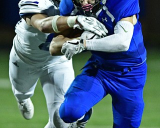 POLAND, OHIO - OCTOBER 13, 2017: Poland's Jonah Spencer is tackled by Lakeview's Drew Munno during the first half of their game Friday night at Poland High School. DAVID DERMER | THE VINDICATOR
