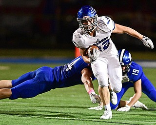 POLAND, OHIO - OCTOBER 13, 2017: Lakeview's Evan Adair returns a kickoff after breaking away from Poland's Zach Ellis and Hayden Kaschak during the first half of their game Friday night at Poland High School. DAVID DERMER | THE VINDICATOR