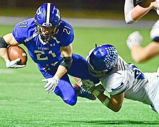 POLAND, OHIO - OCTOBER 13, 2017: Poland's Dante Romano is tackled by Lakeview's Drew Munno during the first half of their game Friday night at Poland High School. DAVID DERMER | THE VINDICATOR