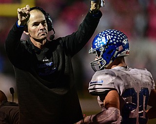 POLAND, OHIO - OCTOBER 13, 2017: Lakeview head coach Tom Pavlansky points to the scoreboard that dons his fathers name as the clock ticks down to zero late in the 4th quarter of Friday nights game at Poland High School. Lakeview won 35-30. DAVID DERMER | THE VINDICATOR