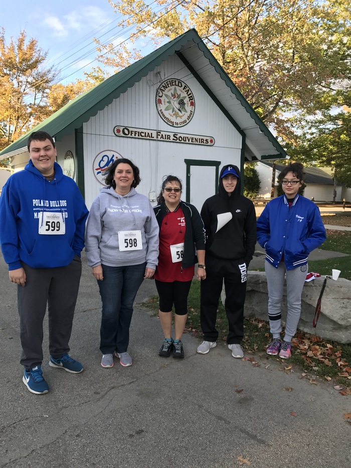 Holy Family Youth Ministry recently participated in the Men and Women United for Life’s second annual Fun Run/Walk for Life at the Canfield Fairgrounds. All money raised will be used to educate youths on character development, making right decisions and living a chaste lifestyle. Viktorya Lange and Colin McDonald each received a first-place medal in their individual categories. Above, from left, are McDonald, Marnie Kelty, Cecilia Lange, Jeremy Castro and Lange.