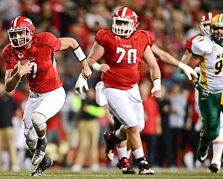 YOUNGSTOWN, OHIO - OCTOBER 14, 2017: Youngstown State's Nathan Mays runs with the football during the first half of their game Saturday night at Stambaugh Stadium. DAVID DERMER | THE VINDICATOR