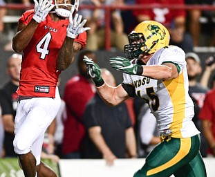 YOUNGSTOWN, OHIO - OCTOBER 14, 2017: Youngstown State's Damoun Patterson catches a touchdown pass behind North Dakota State's Levi Jordheim during the first half of their game Saturday night at Stambaugh Stadium. DAVID DERMER | THE VINDICATOR