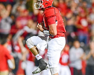 YOUNGSTOWN, OHIO - OCTOBER 14, 2017: Youngstown State's Nathan Mays celebrates after throwing a touchdown pass during the first half of their game Saturday night at Stambaugh Stadium. DAVID DERMER | THE VINDICATOR