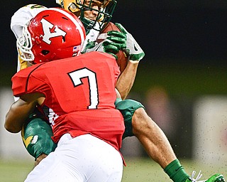 YOUNGSTOWN, OHIO - OCTOBER 14, 2017: North Dakota State's Darrius Shepherd is hit by Youngstown State's Bryce Gibson after a reception during the first half of their game Saturday night at Stambaugh Stadium. DAVID DERMER | THE VINDICATOR